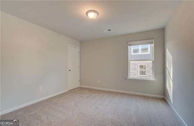2525 Dixon Pl, Lawrenceville, GA 30045 - unfurnished room featuring light carpet and baseboards