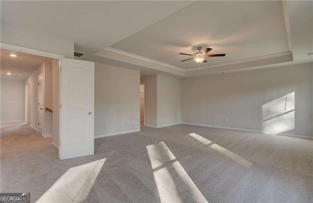 2525 Dixon Pl, Lawrenceville, GA 30045 - carpeted spare room featuring a tray ceiling, a ceiling fan, baseboards, and recessed lighting