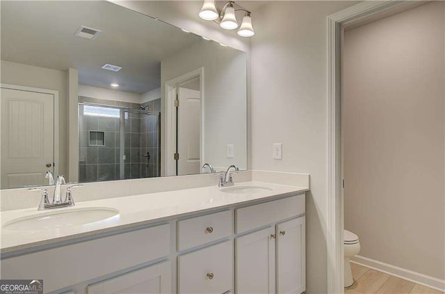 2525 Dixon Pl, Lawrenceville, GA 30045 - full bath with double vanity, a stall shower, toilet, and baseboards