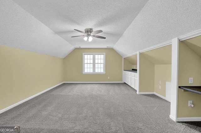 985 Laurel Springs Ln, Marietta, GA 30064 - bonus room featuring a textured ceiling, ceiling fan, carpet floors, and lofted ceiling