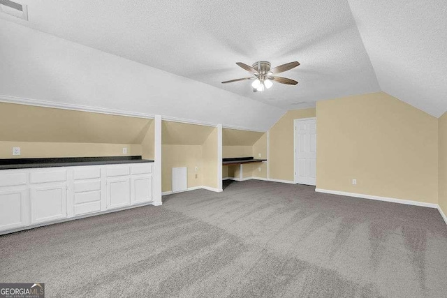 985 Laurel Springs Ln, Marietta, GA 30064 - bonus room with a ceiling fan, carpet flooring, vaulted ceiling, and a textured ceiling