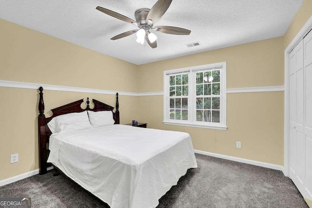 985 Laurel Springs Ln, Marietta, GA 30064 - bedroom featuring carpet flooring, a textured ceiling, a ceiling fan, and a closet