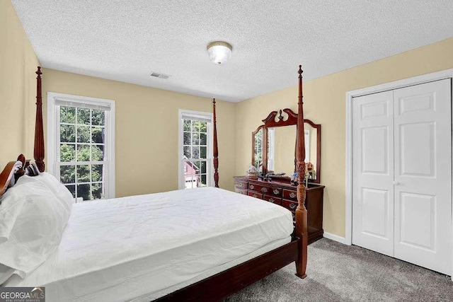 985 Laurel Springs Ln, Marietta, GA 30064 - carpeted bedroom with a textured ceiling and baseboards