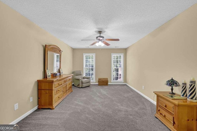 985 Laurel Springs Ln, Marietta, GA 30064 - living area featuring ceiling fan, a textured ceiling, and carpet flooring