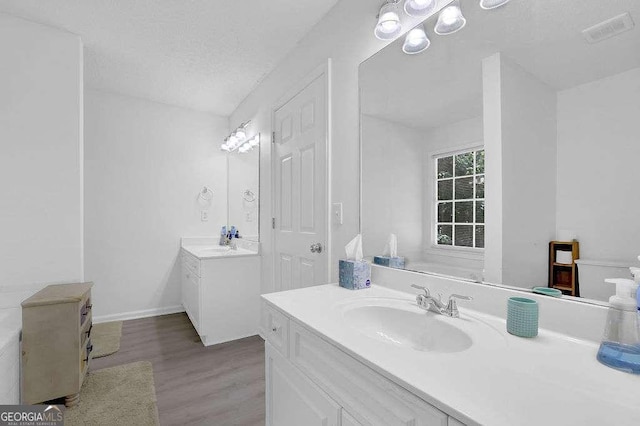 985 Laurel Springs Ln, Marietta, GA 30064 - full bathroom with two vanities and wood finished floors