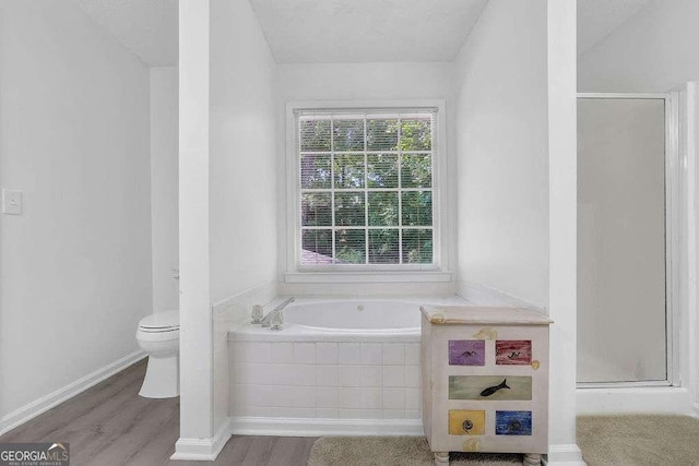 985 Laurel Springs Ln, Marietta, GA 30064 - full bath with wood finished floors, a bath, and a stall shower