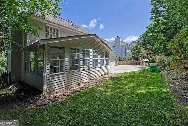 985 Laurel Springs Ln, Marietta, GA 30064 - view of property exterior featuring a patio and a sunroom