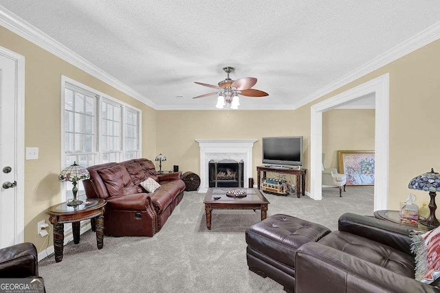 985 Laurel Springs Ln, Marietta, GA 30064 - carpeted living room featuring a ceiling fan, crown molding, a textured ceiling, and a fireplace