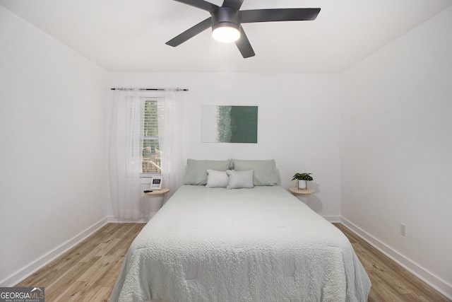 2537 Baker Rd NW, Atlanta, GA 30318 - bedroom featuring light wood-style floors, baseboards, and a ceiling fan