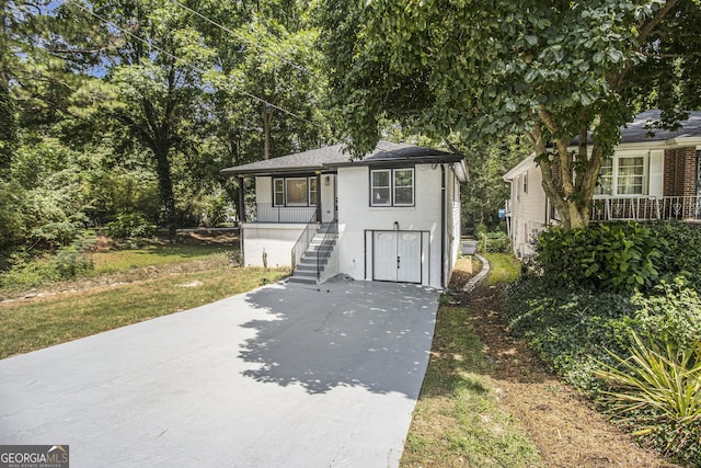 2537 Baker Rd NW, Atlanta, GA 30318 - view of front facade featuring stairs and concrete driveway