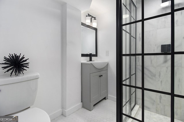 2537 Baker Rd NW, Atlanta, GA 30318 - bathroom featuring toilet, vanity, walk in shower, and baseboards