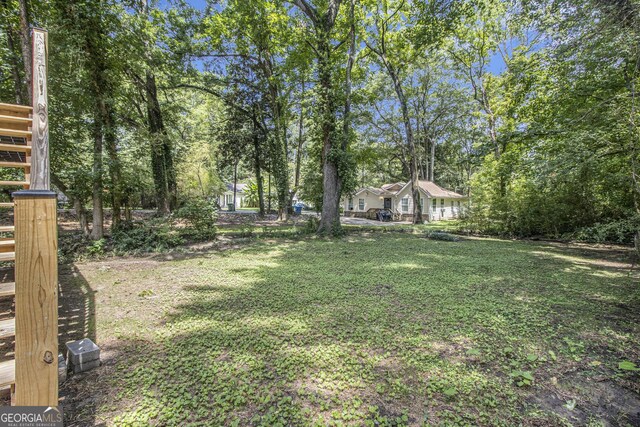 2537 Baker Rd NW, Atlanta, GA 30318 - view of green lawn with view of wooded area