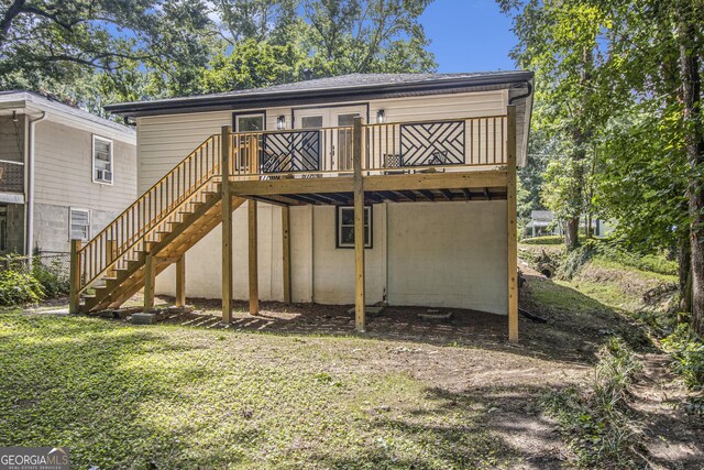 2537 Baker Rd NW, Atlanta, GA 30318 - back of house featuring a wooden deck, a yard, and stairs