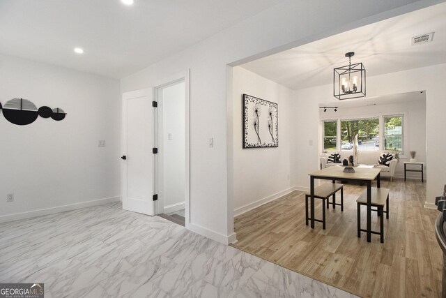 2537 Baker Rd NW, Atlanta, GA 30318 - dining room featuring a chandelier, baseboards, recessed lighting, and marble finish floors