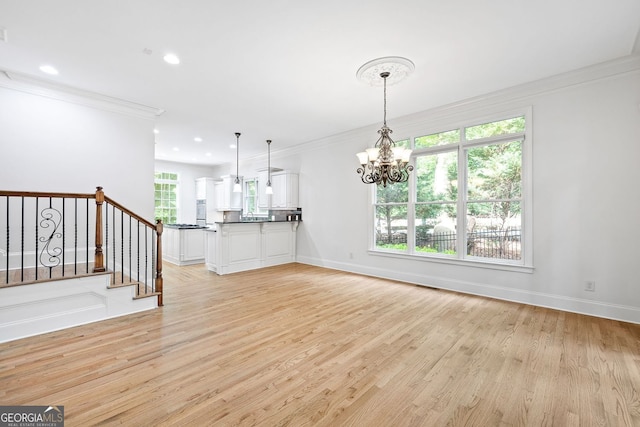 576 Cliftwood Ct, Sandy Springs, GA 30328 - unfurnished living room with a chandelier, crown molding, light wood finished floors, recessed lighting, and stairway