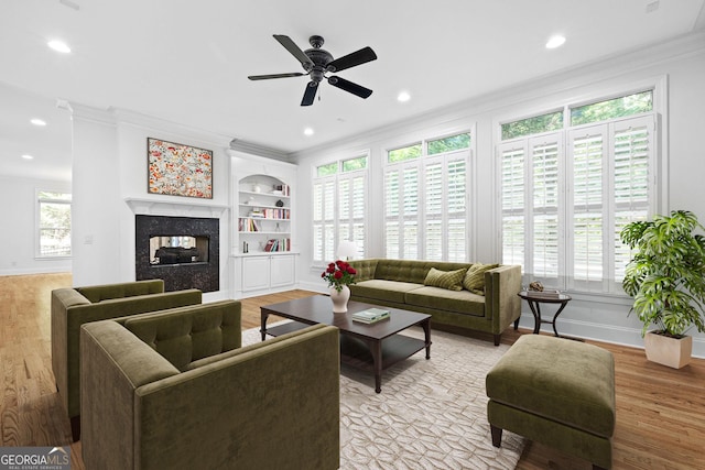 576 Cliftwood Ct, Sandy Springs, GA 30328 - living room featuring crown molding, a ceiling fan, a fireplace, light wood-style floors, and recessed lighting