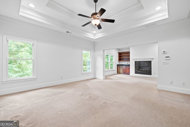 576 Cliftwood Ct, Sandy Springs, GA 30328 - unfurnished living room with a tray ceiling, crown molding, a fireplace, a ceiling fan, and carpet