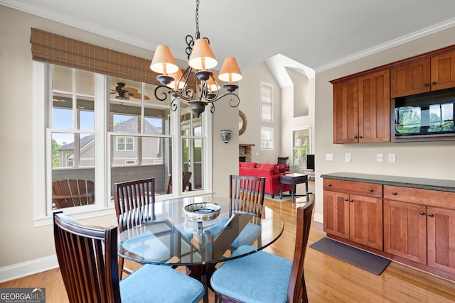 541 Brown Dr, Clermont, GA 30527 - dining room featuring light wood finished floors, baseboards, ornamental molding, and a chandelier