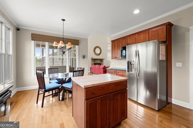 541 Brown Dr, Clermont, GA 30527 - kitchen with stainless steel fridge, light wood-style floors, dishwashing machine, baseboards, and ornamental molding
