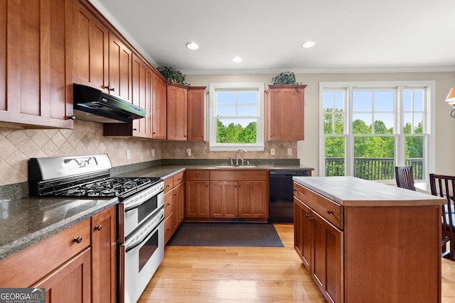 541 Brown Dr, Clermont, GA 30527 - kitchen with under cabinet range hood, double oven range, dishwasher, ornamental molding, and a sink