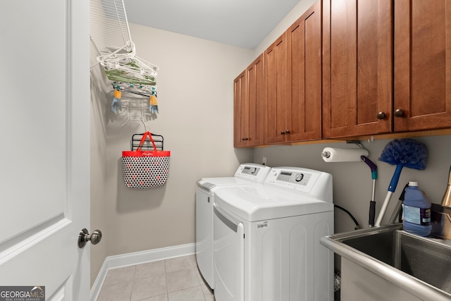 541 Brown Dr, Clermont, GA 30527 - laundry room featuring separate washer and dryer, cabinet space, baseboards, and light tile patterned floors
