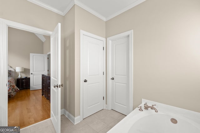 541 Brown Dr, Clermont, GA 30527 - full bath featuring crown molding, a garden tub, tile patterned floors, and baseboards
