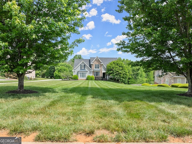 541 Brown Dr, Clermont, GA 30527 - view of front of house featuring a front lawn and stone siding