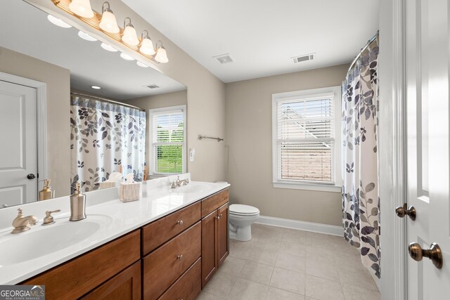 541 Brown Dr, Clermont, GA 30527 - full bath featuring double vanity, toilet, tile patterned flooring, baseboards, and curtained shower