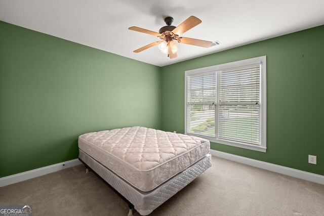 541 Brown Dr, Clermont, GA 30527 - carpeted bedroom with baseboards and a ceiling fan