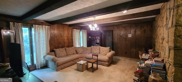 1992 Kunuga Dr, Jonesboro, GA 30236 - carpeted living room featuring wood walls, beamed ceiling, and a chandelier