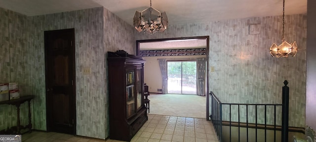 1992 Kunuga Dr, Jonesboro, GA 30236 - entryway featuring a chandelier, light colored carpet, wallpapered walls, and light tile patterned flooring
