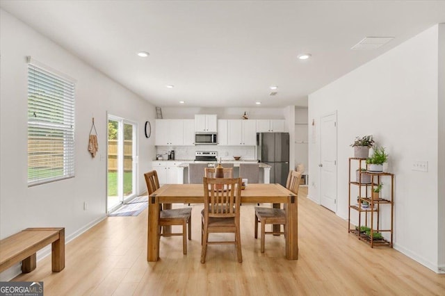 218 Lookout Dr, Dallas, GA 30132 - dining room with light wood finished floors and recessed lighting