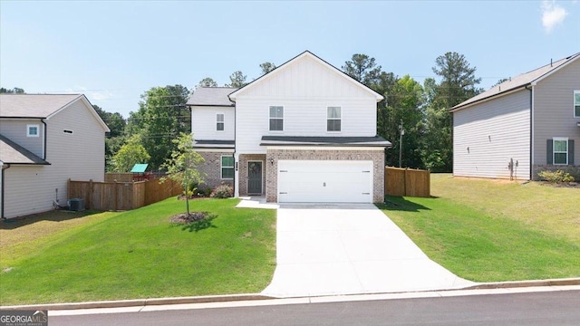 218 Lookout Dr, Dallas, GA 30132 - view of front of house with board and batten siding, concrete driveway, brick siding, and an attached garage
