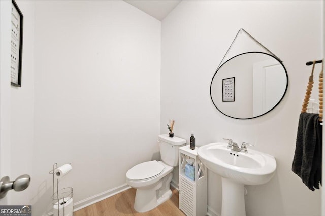 218 Lookout Dr, Dallas, GA 30132 - bathroom featuring wood finished floors and toilet