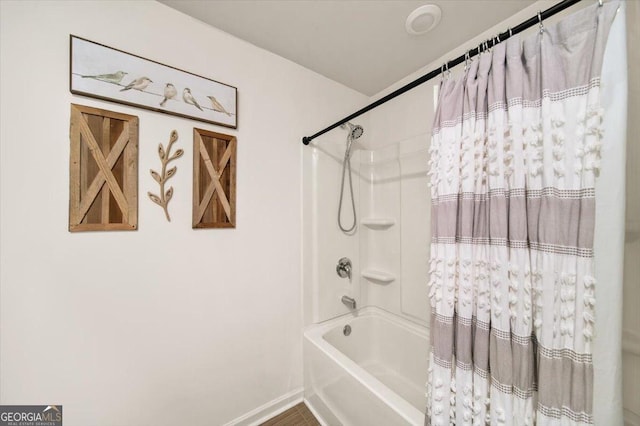 218 Lookout Dr, Dallas, GA 30132 - bathroom featuring shower / tub combo with curtain and baseboards