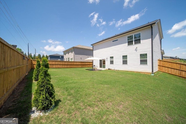 218 Lookout Dr, Dallas, GA 30132 - rear view of house with a fenced backyard