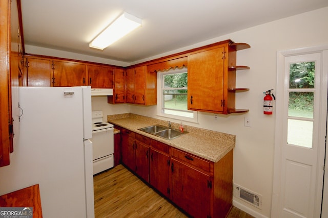 205 Northcrest Dr, Athens, GA 30601 - kitchen with a sink, white appliances, light wood-style flooring, under cabinet range hood, and light countertops