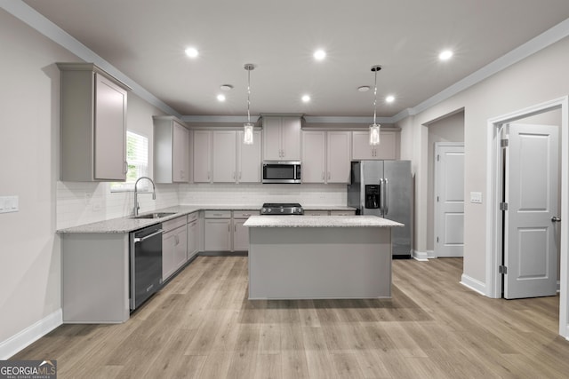 272 Broadstone Blvd, Acworth, GA 30101 - kitchen featuring stainless steel appliances, gray cabinetry, a sink, a kitchen island, and crown molding