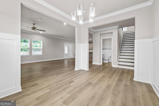 272 Broadstone Blvd, Acworth, GA 30101 - unfurnished room featuring ornamental molding, stairway, light wood-style floors, ceiling fan, and a chandelier