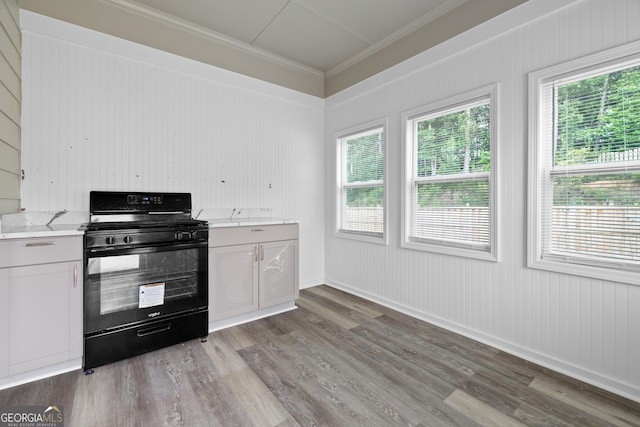272 Broadstone Blvd, Acworth, GA 30101 - kitchen featuring black gas stove, light wood-type flooring, crown molding, light stone countertops, and baseboards