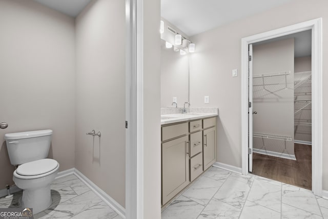 272 Broadstone Blvd, Acworth, GA 30101 - full bath featuring marble finish floors, vanity, toilet, a spacious closet, and baseboards