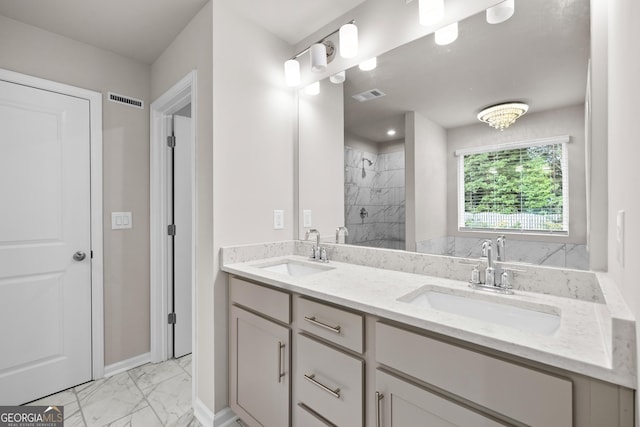272 Broadstone Blvd, Acworth, GA 30101 - bathroom featuring marble finish flooring, tiled shower, double vanity, and baseboards