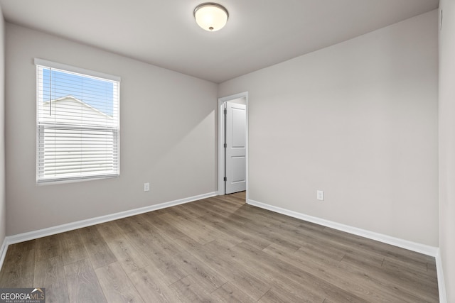 272 Broadstone Blvd, Acworth, GA 30101 - empty room with wood finished floors, baseboards, and plenty of natural light