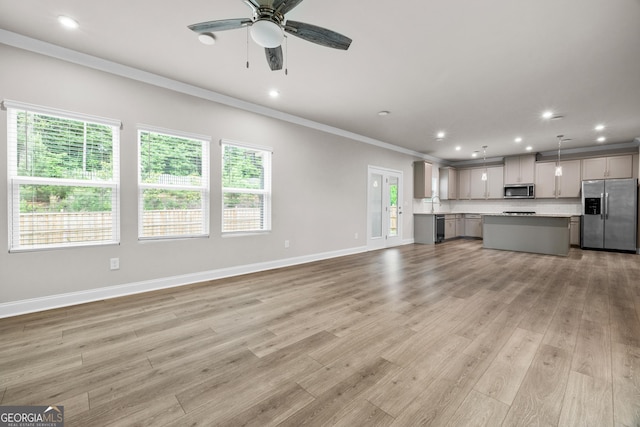 272 Broadstone Blvd, Acworth, GA 30101 - unfurnished living room featuring ornamental molding, recessed lighting, a ceiling fan, and light wood finished floors