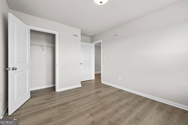 272 Broadstone Blvd, Acworth, GA 30101 - unfurnished bedroom with wood finished floors, baseboards, and a closet