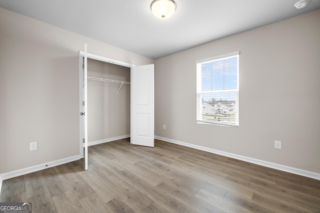 272 Broadstone Blvd, Acworth, GA 30101 - unfurnished bedroom with wood finished floors, baseboards, and a closet