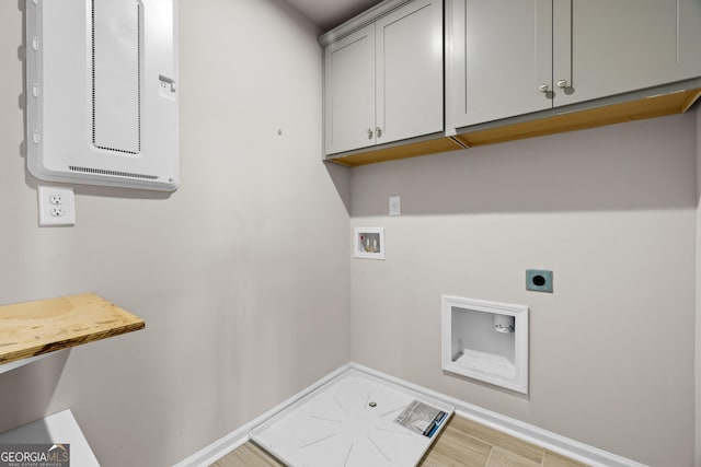272 Broadstone Blvd, Acworth, GA 30101 - washroom with electric dryer hookup, washer hookup, cabinet space, and light wood-type flooring