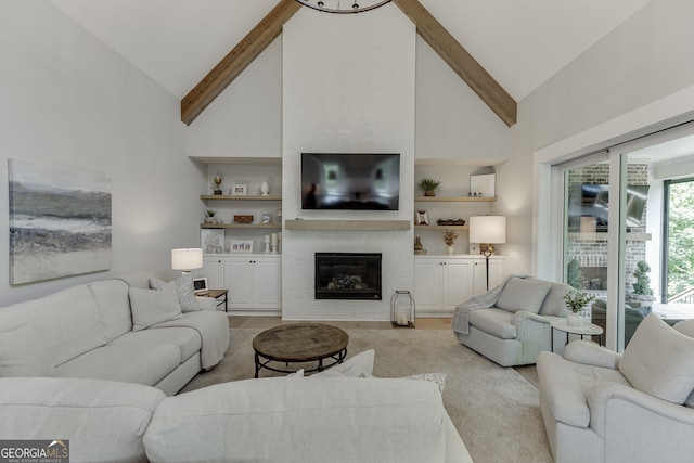 4781 Falling Brook Dr, Flowery Branch, GA 30542 - living area featuring light wood-type flooring, high vaulted ceiling, beamed ceiling, a large fireplace, and built in features