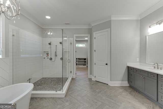 4781 Falling Brook Dr, Flowery Branch, GA 30542 - full bathroom featuring a shower stall, vanity, a freestanding bath, crown molding, and a chandelier