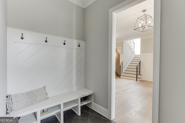 4781 Falling Brook Dr, Flowery Branch, GA 30542 - mudroom featuring a chandelier, ornamental molding, and wainscoting